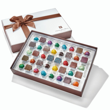 80 Piece Signature Chocolate Collection tied with brown ribbon