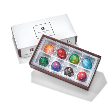 Eight different chocolate bonbons in bright colors